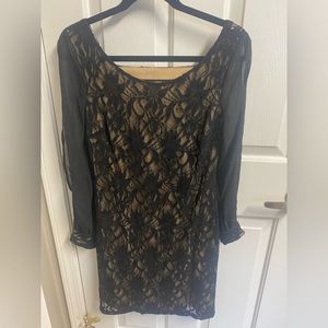 Beautiful lace black dress with skin color lining.